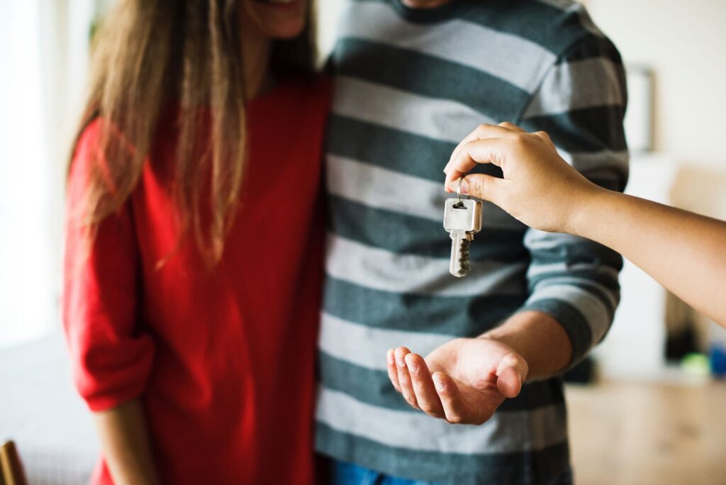 a couple receiving a set of keys