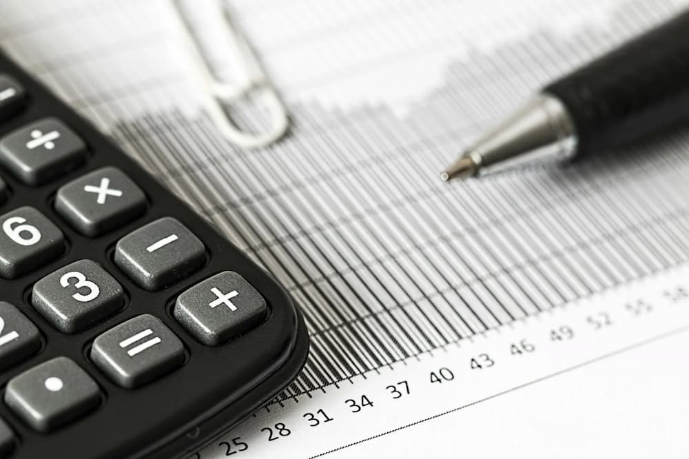 black calculator and tax bill minimising tax liability